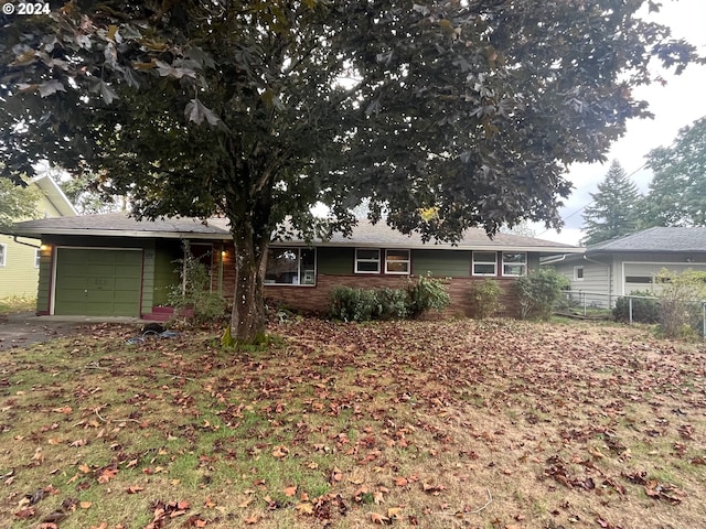 single story home with a garage