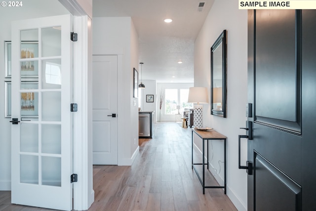 corridor featuring light hardwood / wood-style flooring