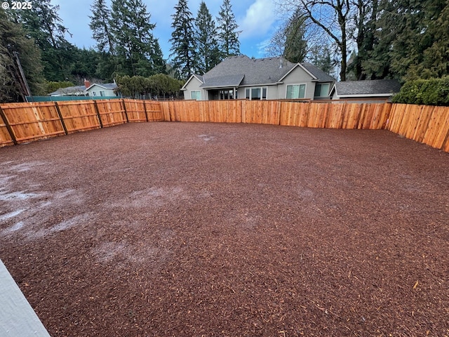 view of yard with a fenced backyard