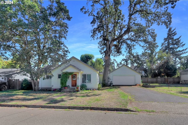 ranch-style house featuring a front yard and a garage