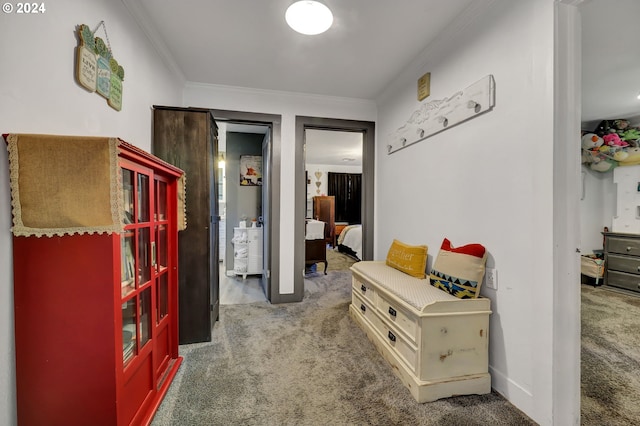 corridor featuring crown molding and carpet flooring