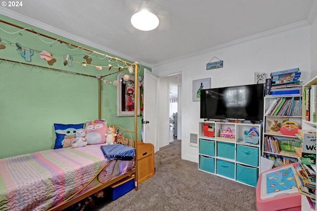 bedroom with carpet floors and crown molding