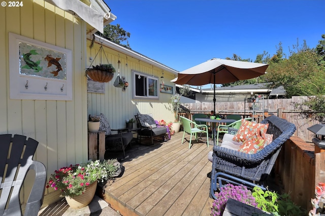 wooden deck featuring outdoor lounge area