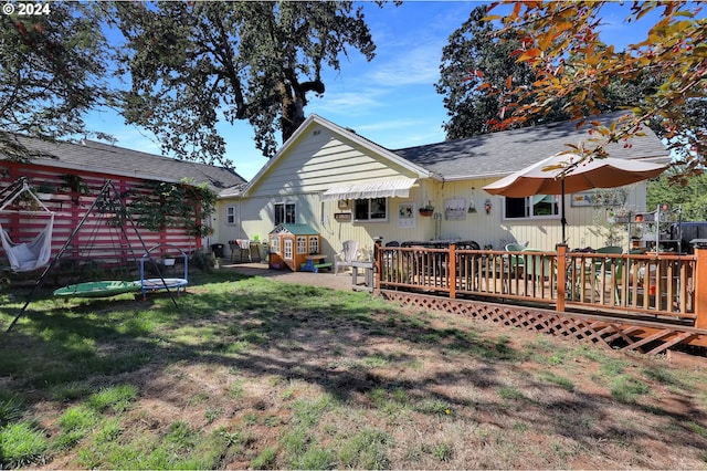 view of yard with a wooden deck