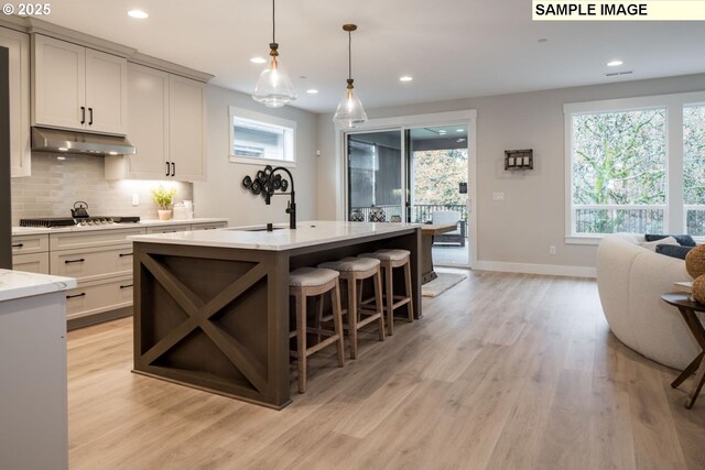8065 N Hargrave St, Camas, WA 98607 - living room with a fireplace, a high ceiling, and dark hardwood / wood-style flooring
