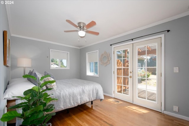 bedroom featuring access to outside, ceiling fan, french doors, and multiple windows