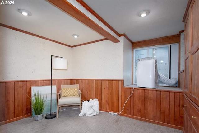 unfurnished room featuring light colored carpet, water heater, and crown molding