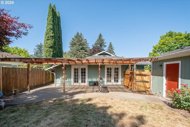 rear view of house with a patio area and french doors