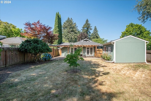 rear view of house with a lawn