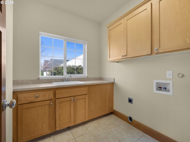 washroom featuring sink, hookup for a washing machine, electric dryer hookup, cabinets, and light tile flooring