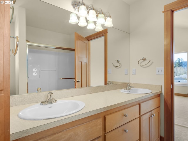 bathroom featuring large vanity and double sink