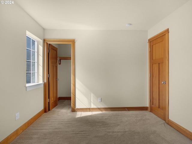 unfurnished room with light colored carpet