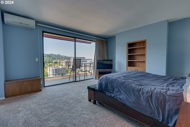 carpeted bedroom with a wall mounted AC and access to exterior