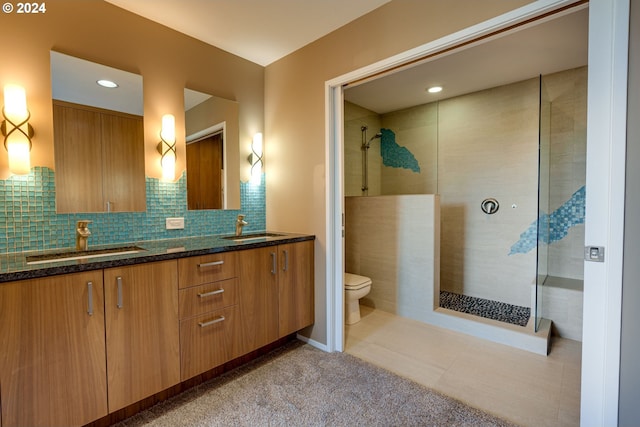 bathroom with a tile shower, tile flooring, backsplash, and toilet