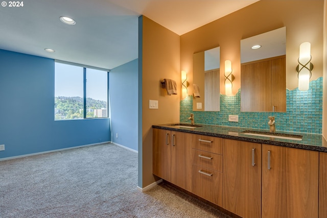 bathroom with tasteful backsplash and dual bowl vanity