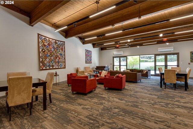 living room featuring beamed ceiling, hardwood / wood-style flooring, wood ceiling, and a wall mounted air conditioner