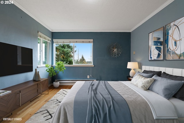 bedroom featuring ornamental molding, a textured ceiling, a baseboard radiator, and light hardwood / wood-style flooring