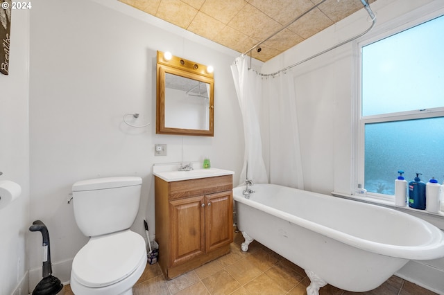 full bathroom with vanity, toilet, tile patterned floors, and shower / bath combination with curtain