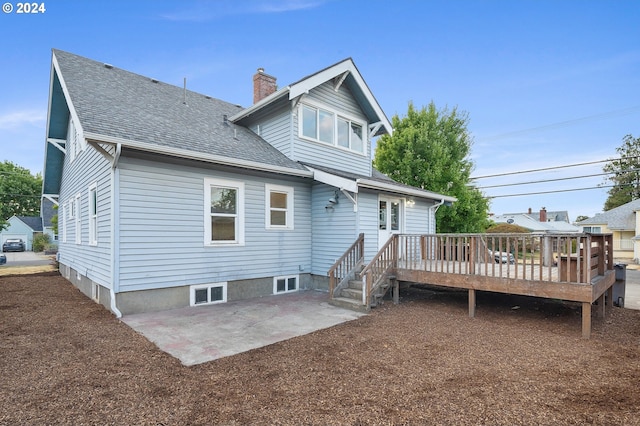 rear view of house with a patio and a deck