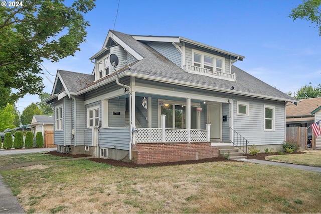 view of front of property featuring a porch and a front yard