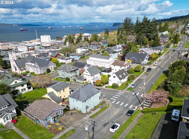 birds eye view of property featuring a water view