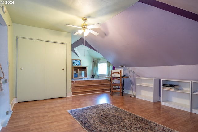 bonus room with lofted ceiling, ceiling fan, and wood-type flooring