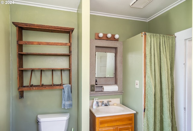 bathroom featuring vanity, toilet, and ornamental molding