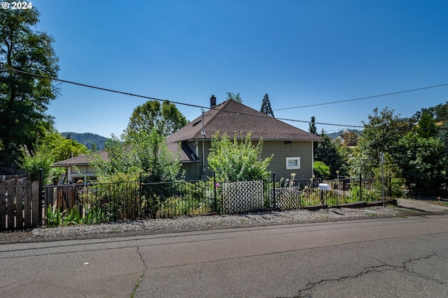 view of property exterior featuring a fenced front yard