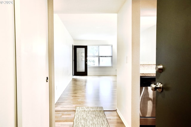 hallway with light wood-type flooring