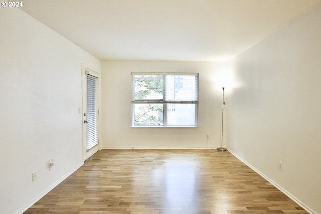 spare room featuring light hardwood / wood-style flooring