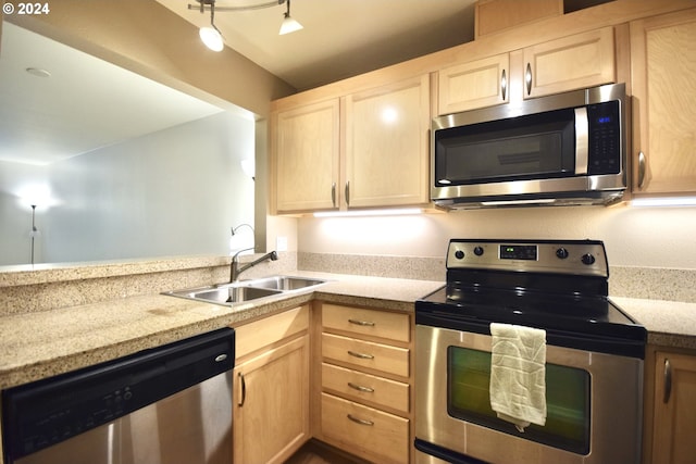 kitchen with sink, light brown cabinetry, and appliances with stainless steel finishes