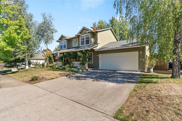 view of front of house featuring covered porch and a garage