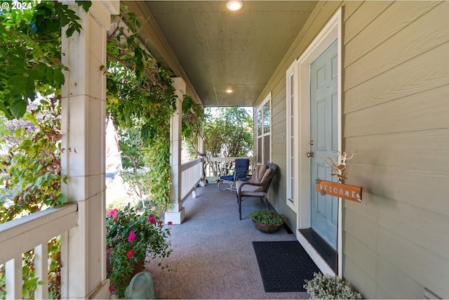 view of patio featuring a porch