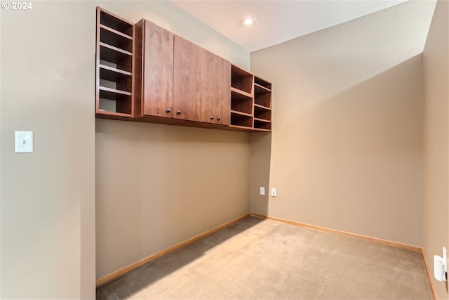 interior space featuring light colored carpet