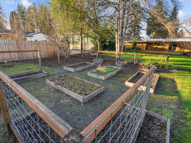 view of yard with a garden and fence