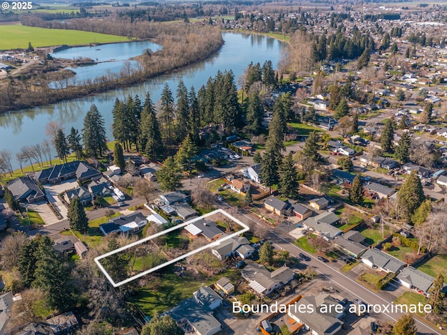 bird's eye view featuring a residential view and a water view