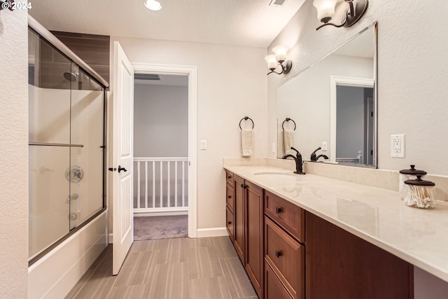 13516 NW Glendoveer Dr, Portland, OR 97231 - full bath with shower / bath combination with glass door, vanity, recessed lighting, and baseboards