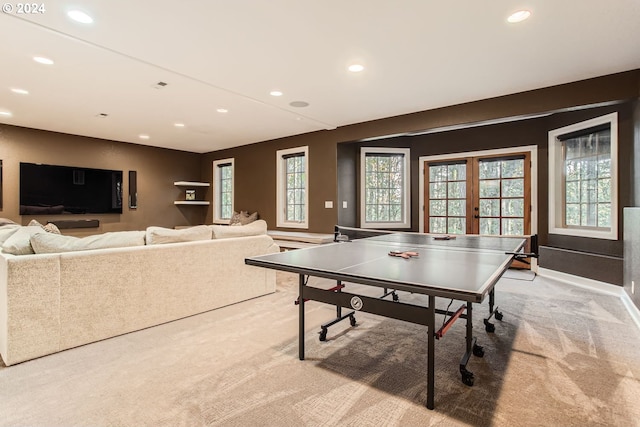 rec room featuring light colored carpet and french doors