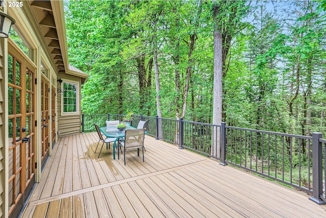 13516 NW Glendoveer Dr, Portland, OR 97231 - deck featuring outdoor dining space and a wooded view
