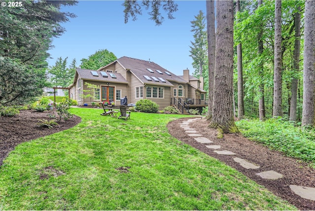 13516 NW Glendoveer Dr, Portland, OR 97231 - rear view of house with a deck, a yard, stairs, and roof with shingles