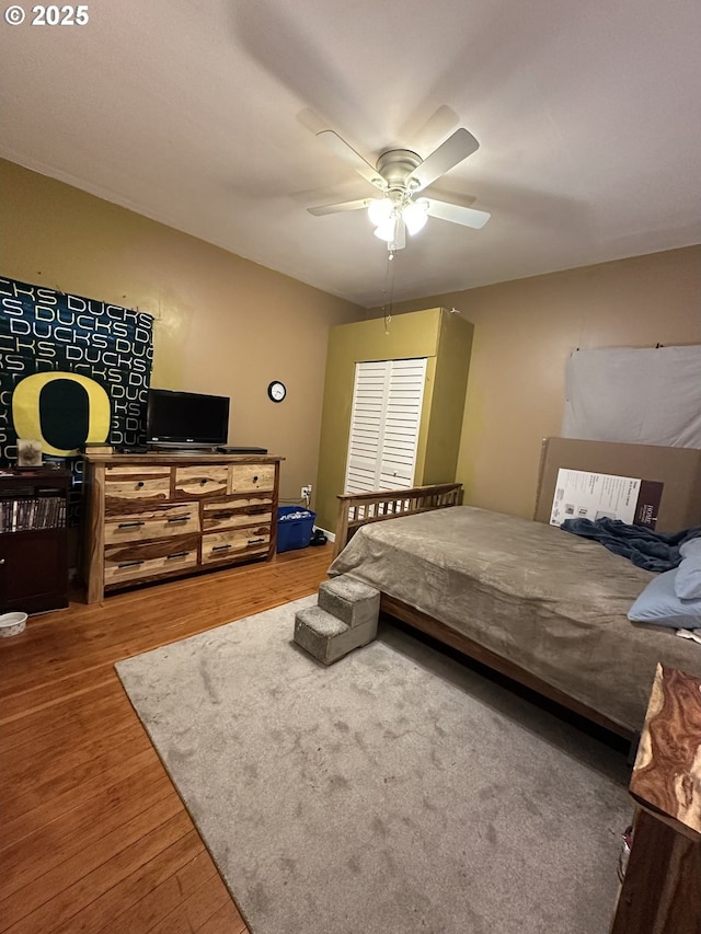 bedroom featuring ceiling fan and wood-type flooring