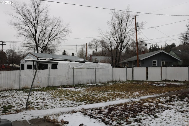 view of yard layered in snow