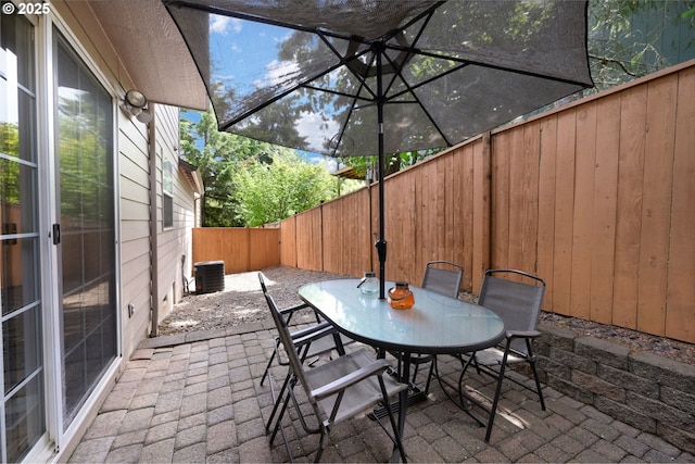 87973 Sherwood St, Veneta, OR 97487 - fenced backyard featuring a patio, central air condition unit, and outdoor dining area