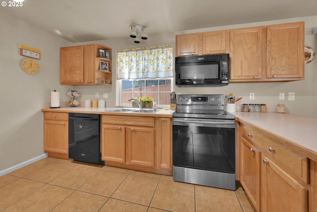 87973 Sherwood St, Veneta, OR 97487 - kitchen with black appliances, a sink, light countertops, and light tile patterned floors