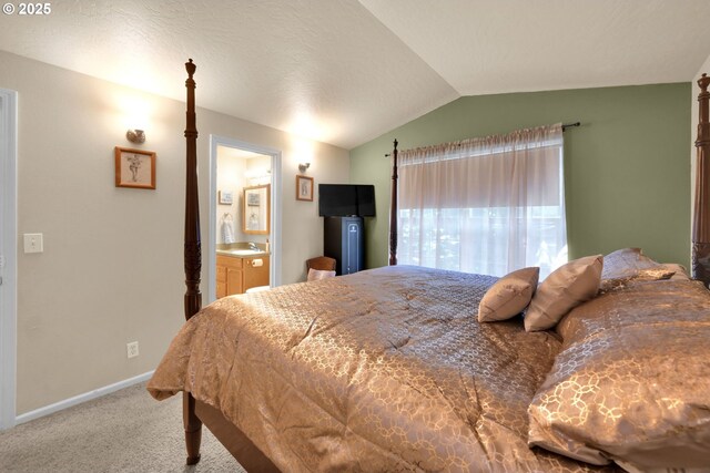 87973 Sherwood St, Veneta, OR 97487 - carpeted bedroom with lofted ceiling, baseboards, a sink, and connected bathroom