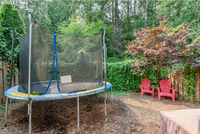 view of yard with a trampoline