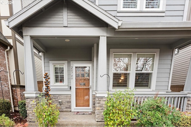 doorway to property with a porch