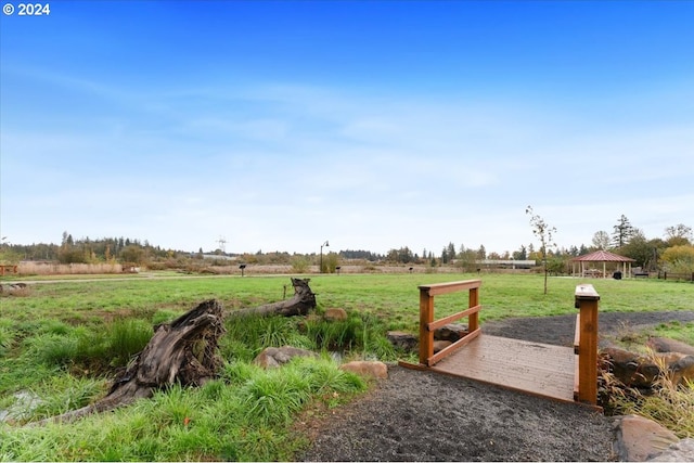 view of yard featuring a rural view and a gazebo