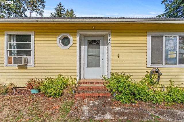 view of exterior entry featuring cooling unit