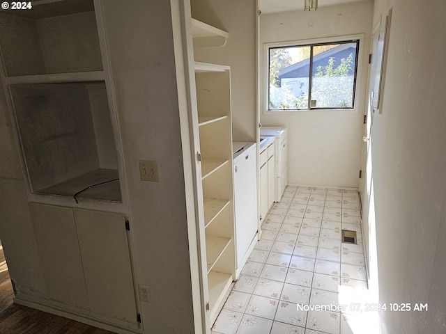 laundry room with separate washer and dryer